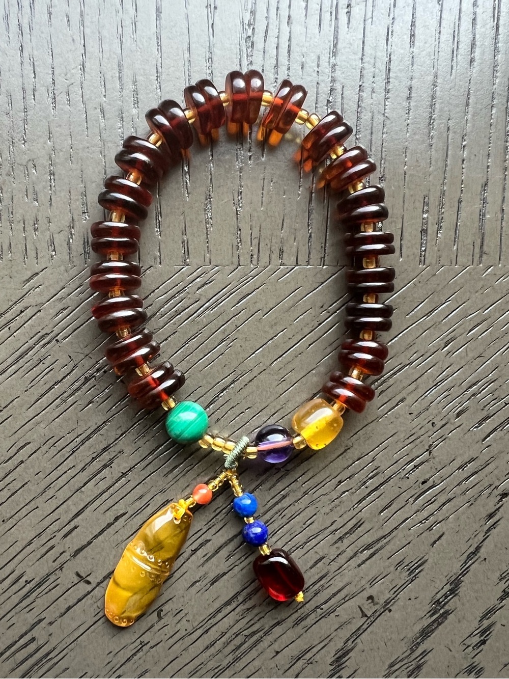 Blood amber donut bracelet with charm 9mm SIZE 6.5’